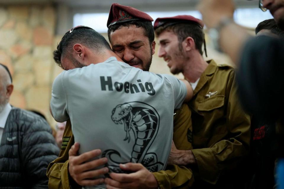 PHOTO: Mourners comfort each other during the funeral of Israeli soldier Benjamin Loeb, a dual Israeli-French citizen, in Jerusalem, Oct. 10, 2023. (Francisco Seco/AP)