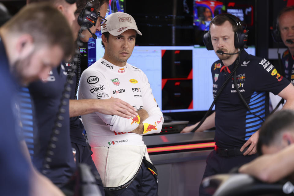 Red Bull driver Sergio Perez of Mexico is in garage before the qualifying session ahead of the Formula One Monaco Grand Prix at the Monaco racetrack, in Monaco, Saturday, May 25, 2024. (Claudia Greco/Pool Photo via AP)