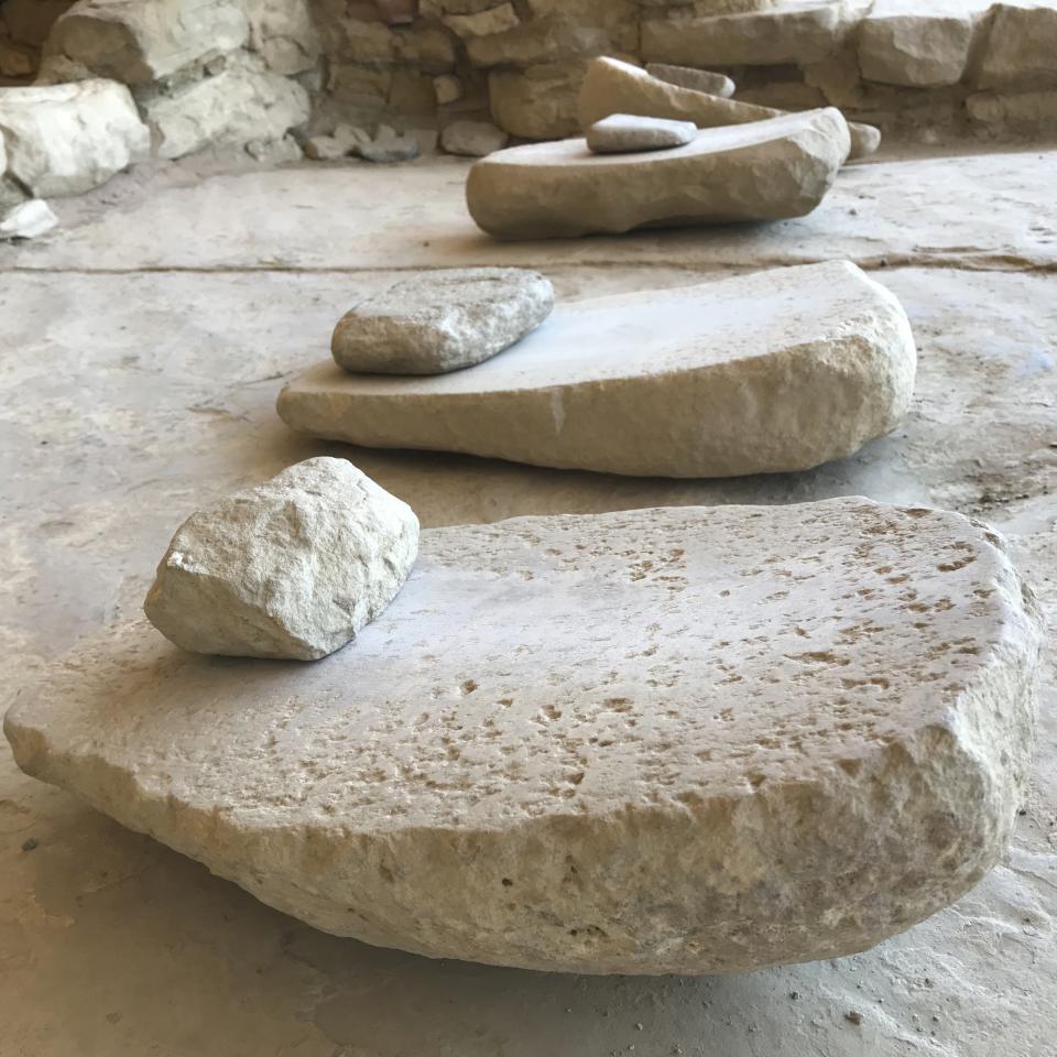 This May 5, 2018 image shows grinding stones at Mesa Verde National Park near Cortez, Colorado. The White House announced Wednesday, Oct. 2, 2019, that Finland has agreed to return Native American ancestral remains and funerary objects that where excavated in 1891 from Mesa Verde and ended up in the collection of the National Museum of Finland. (AP Photo/Susan Montoya Bryan)