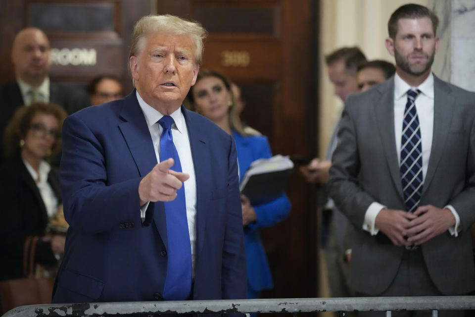 Former President Donald Trump speaks during a break in his civil business fraud trial at New York Supreme Court, Wednesday, Oct. 25, 2023, in New York. The judge in Donald Trump's civil fraud trial has fined the former president $10,000. The judge says Trump violated a limited gag order barring personal attacks on court staffers.(AP Photo/Seth Wenig)