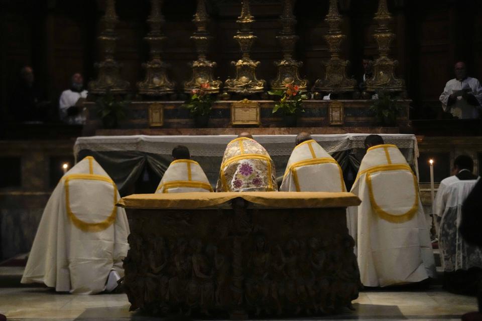 A celebrating priest leads a Latin Mass at Rome's ancient Pantheon basilica, in Rome, Italy, Friday, Oct. 29, 2021. Traditionalist Catholics descended on Rome on Friday for their annual pilgrimage, hoping to show the vibrancy of their community after Pope Francis issued a crackdown on the spread of the Latin Mass that many took as an attack on the ancient rite. An evening vespers service at Rome's ancient Pantheon basilica, the first event of the three-day pilgrimage, was so full that ushers had to add two rows of chairs to accommodate the faithful. Many young families, couples and priests filled the pews, hailing from the U.S., France, Spain and beyond. (AP Photo/Luca Bruno)