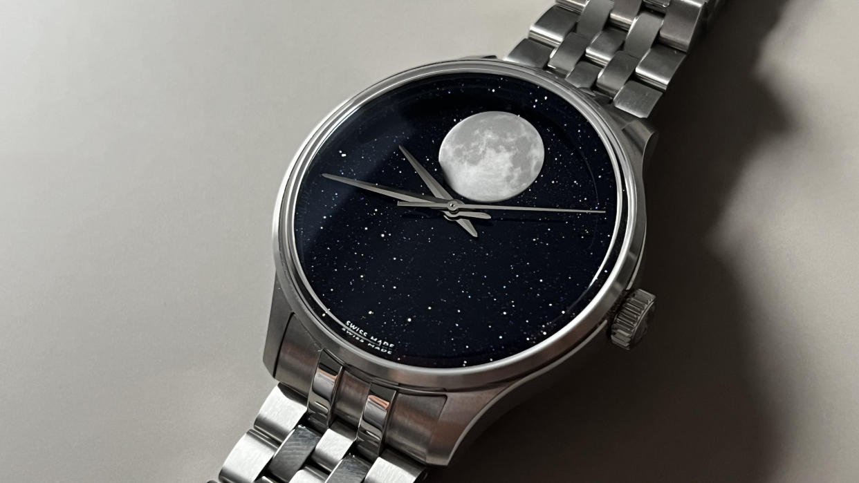 The Christopher Ward C1 MoonPhase on a grey background. 