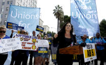 FILE - In this Aug. 28, 2019 file photo Assemblywoman Lorena Gonzalez, D-San Diego, speaks at rally calling for passage of her measure to limit when companies can label workers as independent contractors, at the Capitol in Sacramento, Calif. Gov. Gavin Newsom signed a measure, to take effect in 2020, making it harder for industries to treat workers like contractors instead of employees who are entitled to minimum wage and other benefits. Uber, Lyft and DoorDash have said they'll spend $30 million to put an initiative on the 2020 ballot to overturn the law. (AP Photo/Rich Pedroncelli, File)