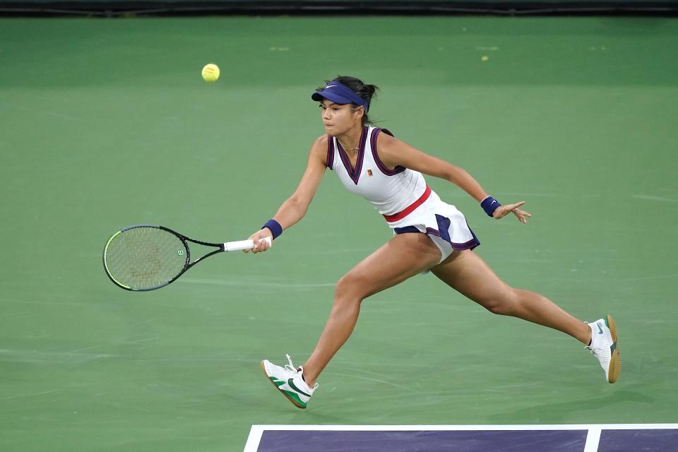 Emma Raducanu returns a shot to Alaksandra Sasnovich at the BNP Paribas Open tennis tournament Friday Oct. 8, 2021 in Indian Wells, Calif. (AP Photo/Mark J. Terrill)