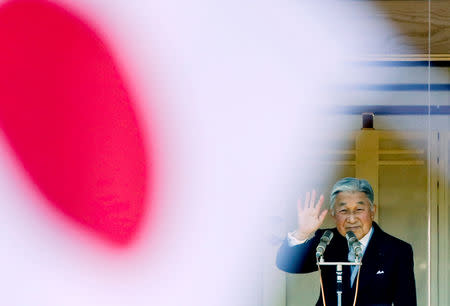 FILE PHOTO : Japan's Emperor Akihito waves to well-wishers gathered to celebrate his 81st birthday at the Imperial Palace in Tokyo December 23, 2014. REUTERS/Thomas Peter/File Photo