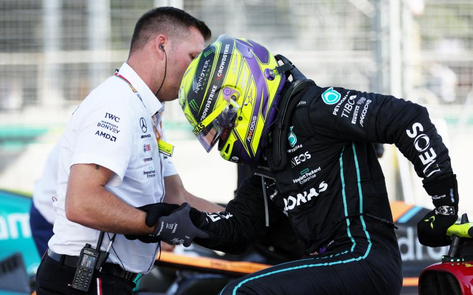 Lewis Hamilton has to be helped from his car - GETTY IMAGES
