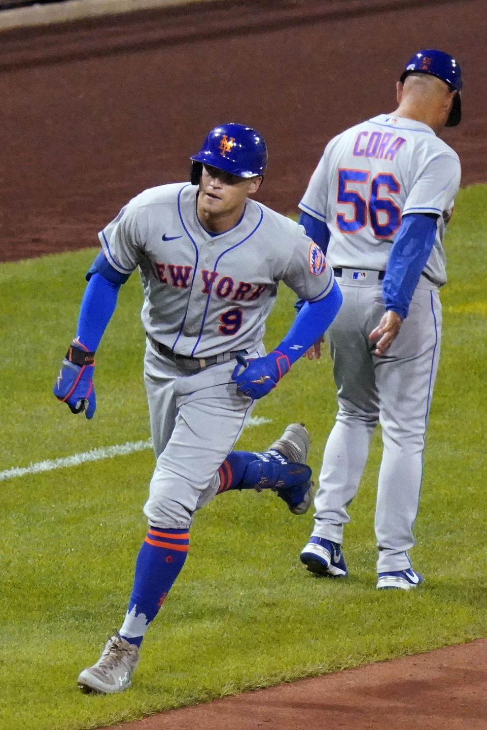 New York Mets' Brandon Nimmo (9) rounds third past third base coach Joey Cora after hitting a two-run home run off Pittsburgh Pirates relief pitcher Robert Stephenson during the seventh inning of a baseball game in Pittsburgh, Tuesday, Sept. 6, 2022. (AP Photo/Gene J. Puskar)