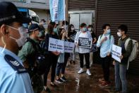 Activists march against new security laws, near China's Liaison Office, in Hong Kong