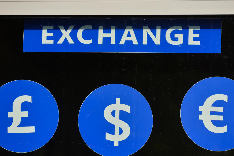 Currency symbols seen on a window of an exchange office in Krakow's old Town. On September 15, 2020, in Krakow, Poland. (Photo by Artur Widak/NurPhoto via Getty Images)