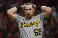 Pittsburgh Pirates' John Nogowski (69) reacts after striking out in the fourth inning of a baseball game against the Cincinnati Reds in Cincinnati on Thursday, Aug. 5, 2021. (AP Photo/Jeff Dean)