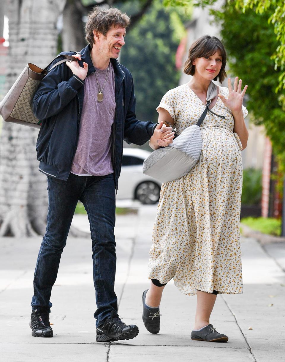 A pregnant Milla Jovovich and husband Paul W. S. Anderson step out for lunch in Hollywood on Friday.