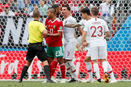 Soccer Football - World Cup - Group B - Portugal vs Morocco - Luzhniki Stadium, Moscow, Russia - June 20, 2018 Referee Mark Geiger with Morocco's Mehdi Carcela, Portugal's Pepe and Adrien Silva REUTERS/Maxim Shemetov