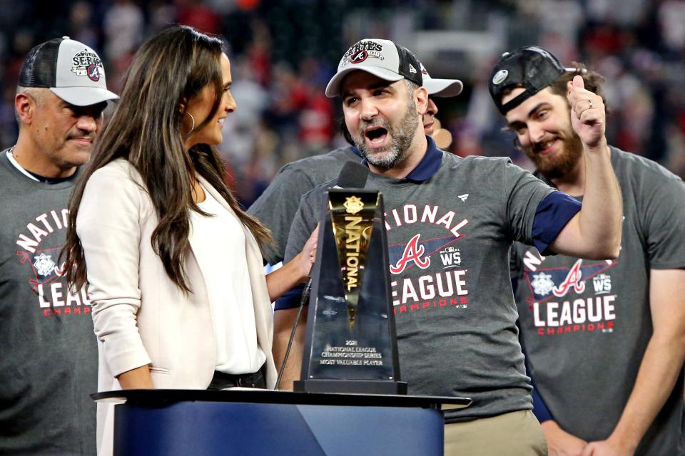 GM Alex Anthopoulos celebrates after Atlanta wins the National League pennant.