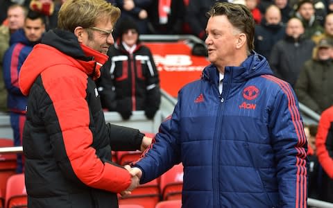 Jurgen Klopp manager of Liverpool and Louis van Gaal manager of Manchester United shake hands before the Barclays Premier League match between Liverpool and Manchester United - Credit: Getty Images