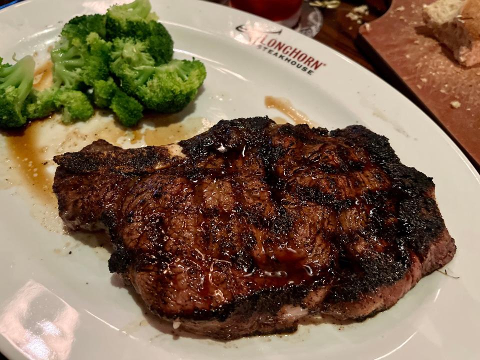 outlaw ribeye with brocoli at longhorn steakhouse