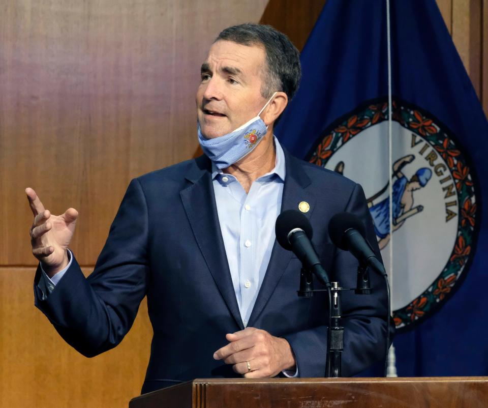 Virginia Gov. Ralph Northam answers a reporter's question during a news briefing on Sept. 1, 2020, inside the Patrick Henry Building in Richmond, Va.