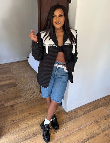 <p>Mindy Kaling/Instagram</p> Mindy Kaling rocks a bra-only look with denim Bermuda shorts