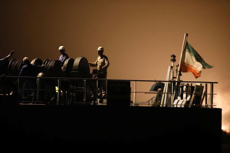 Crew of the Iranian tanker ship "Fortune" are seen at the deck during the arrival at El Palito refinery in Puerto Cabello