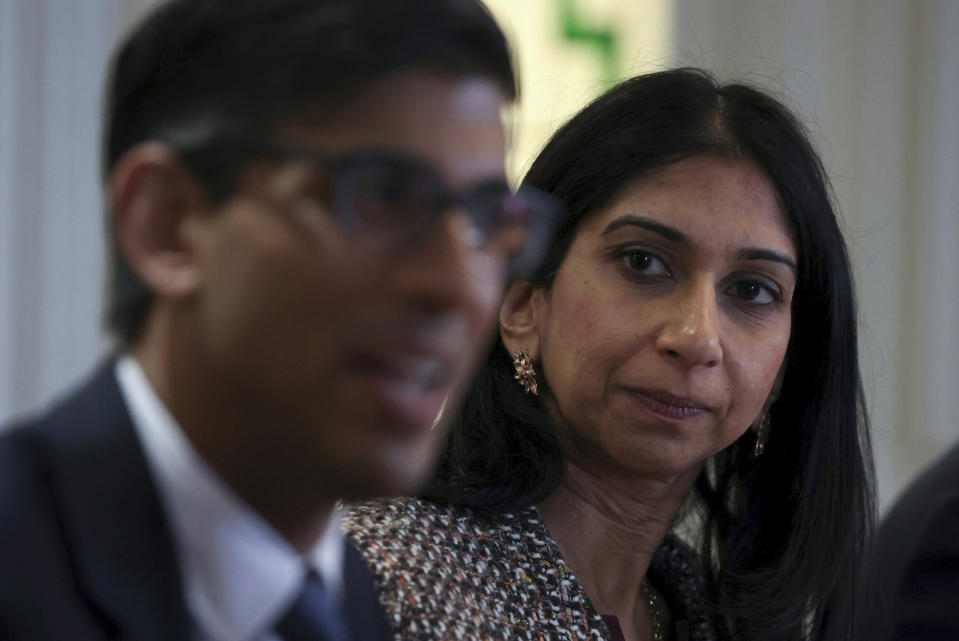 FILE - Britain's Prime Minister Rishi Sunak, left, and Britain's Home Secretary Suella Braverman, attend a meeting with the local community and police leaders following the announcement of a new police task force to help officers tackle grooming gangs, in Rochdale, England, Monday, April 3, 2023. (Phil Noble/Pool Photo via AP, File)