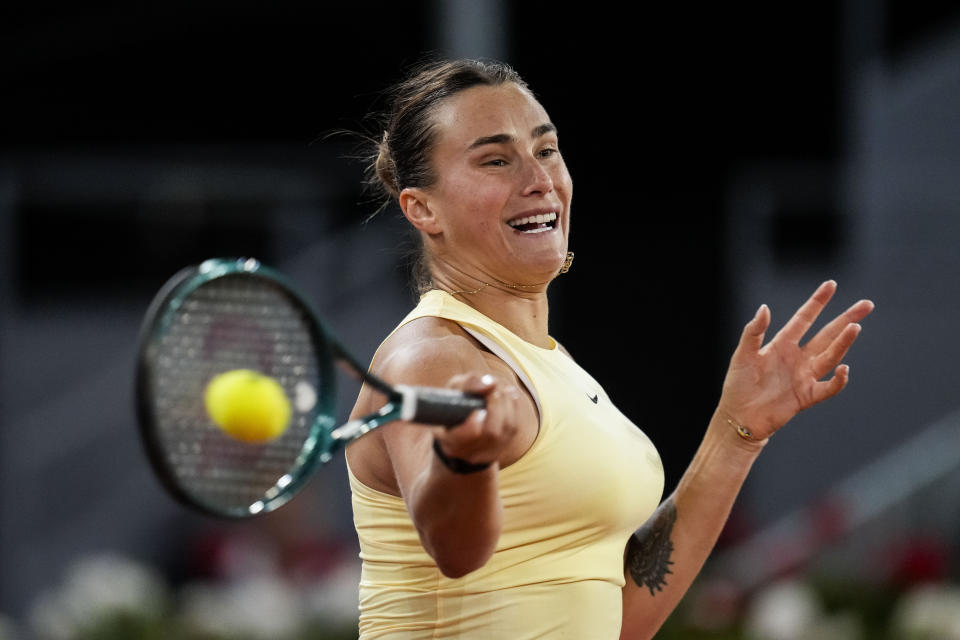 Aryna Sabalenka, of Belarus, returns the ball to Mirra Andreeva, of Russia, during the Mutua Madrid Open tennis tournament in Madrid, Wednesday, May 1, 2024. (AP Photo/Manu Fernandez)