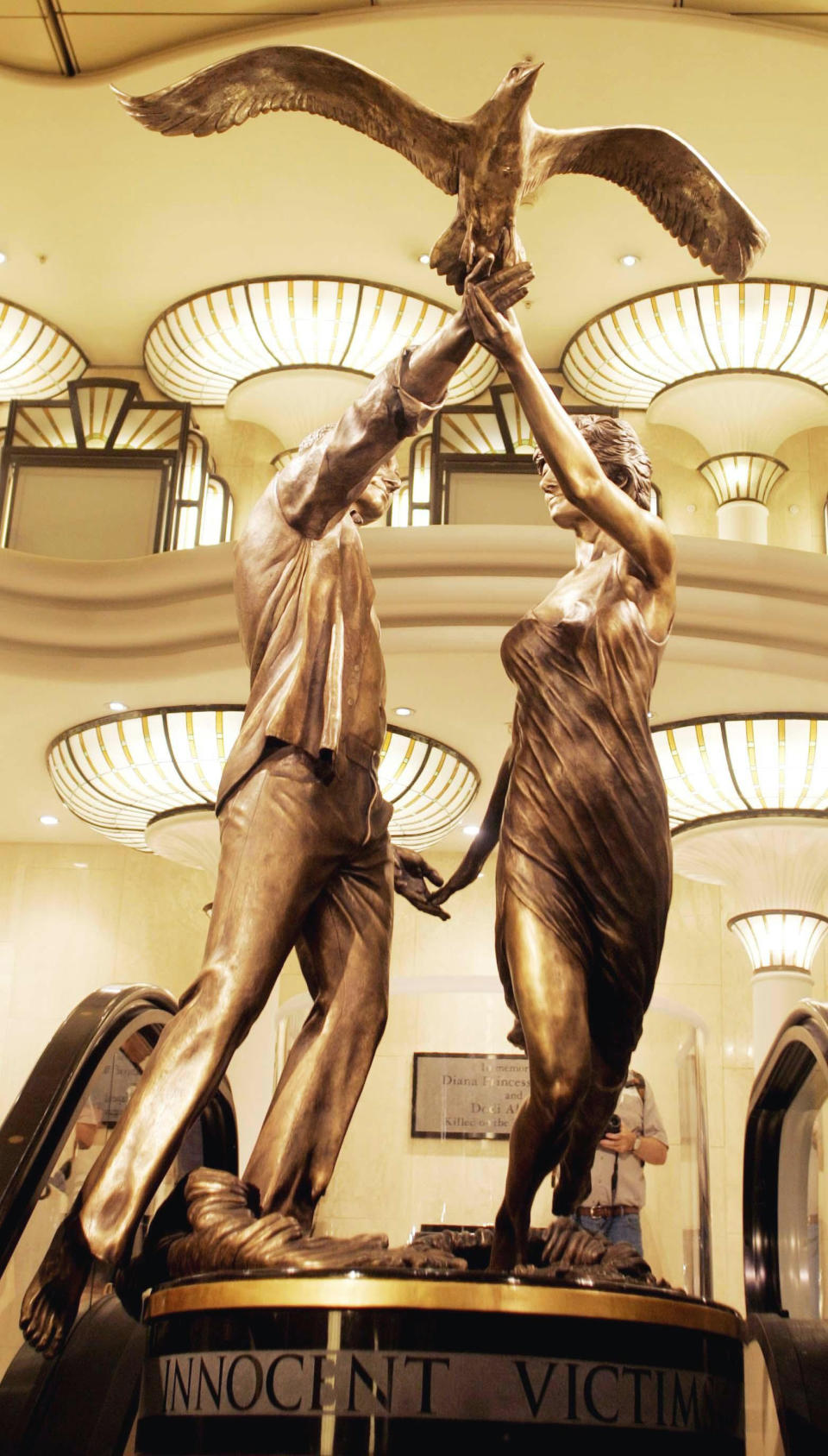 A bronze memorial of the couple was erected in Harrods [Photo: PA]