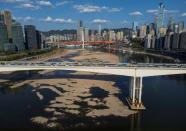 A view of bridges that cross over the partially dried-up riverbed of the Jialing river, a tributary of the Yangtze, that is approaching record low water levels in Chongqing