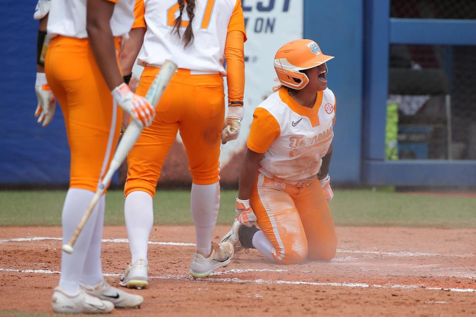 Tennessee's Destiny Rodriguez (34) after scoring a run in the second inning of a softball game between Tennessee and Alabama in the Women's College World Series at USA Softball Hall of Fame Stadium in Oklahoma City, Thursday, June 1, 2023. 