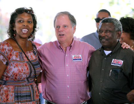 Democratic Alabama U.S. Senate candidate Doug Jones (L) greets supporters while campaigning at an outdoor festival in Grove Hill, Alabama, U.S. on November 4, 2017. REUTERS/Mike Kittrell