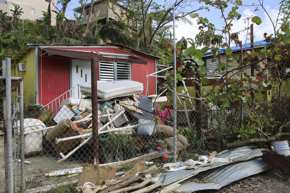 Debris piles up in front of homes affected by Hurricane Maria. Can&oacute;vanas, Puerto Rico. October 14, 2017.