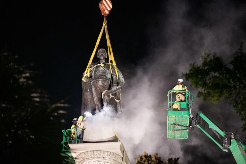<div class="inline-image__caption"><p>A worker uses a saw at the foot of the statue of John C. Calhoun atop the monument in his honor at Marion Square in Charleston, South Carolina. </p></div> <div class="inline-image__credit">Sean Rayford/Getty</div>