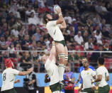 South Africa's Lood de Jager catches a ball during the Rugby World Cup Pool B game at the Toyota Stadium between South Africa and Namibia in Toyota, central Japan, Saturday, Sept. 28, 2019. (Kyodo News via AP)