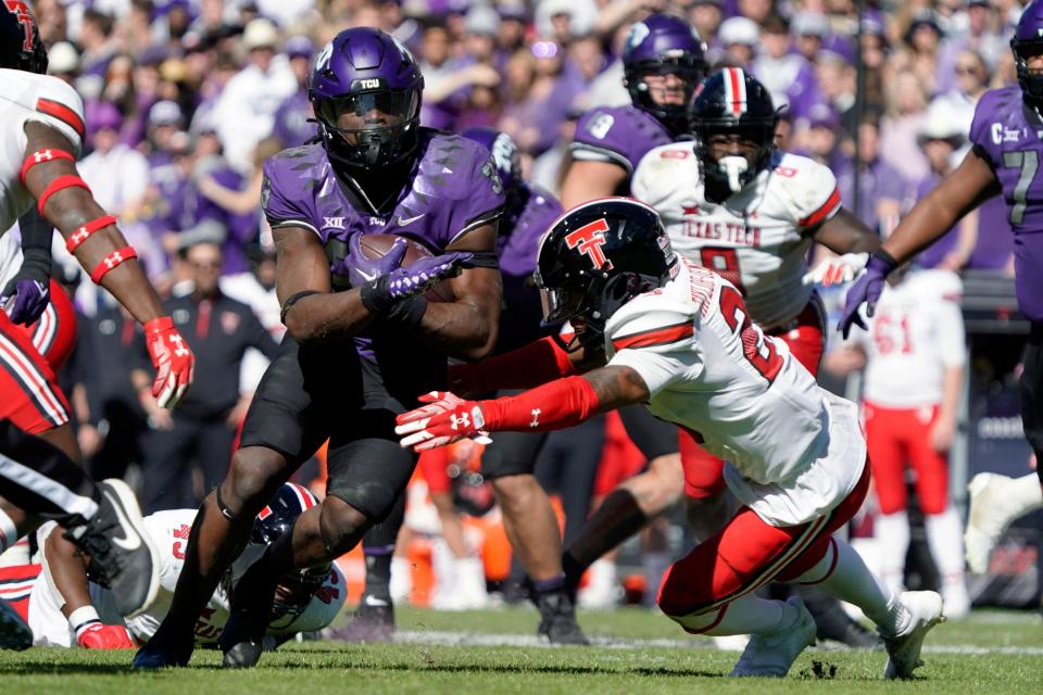 TCU tailback Kendre Miller carries the ball past Texas Tech's Dadrion Taylor-Demerson last week. RAYMOND CARLIN III/USA Today Spots