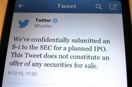 A tweet from Twitter Inc. announcing its initial public offering is shown in this photo illustration in Toronto, September 12, 2013. REUTERS/Hyungwon Kang