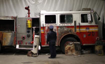 A New York City Fire Department engine recovered from the World Trade Center disaster site sits inside Hangar 17 at New York's John F. Kennedy International Airport June 16, 2011. A program operated by the Port Authority of New York and New Jersey, The World Trade Center steel program, is selecting portions of the steel recovered from the World Trade Center and donating it to cities, towns, firehouses and museums around the U.S. and the world who request it for use in 911 memorial sites in time for the 10 year anniversary of the 2001 attacks. Picture taken June 16, 2011. (REUTERS/Mike Segar)