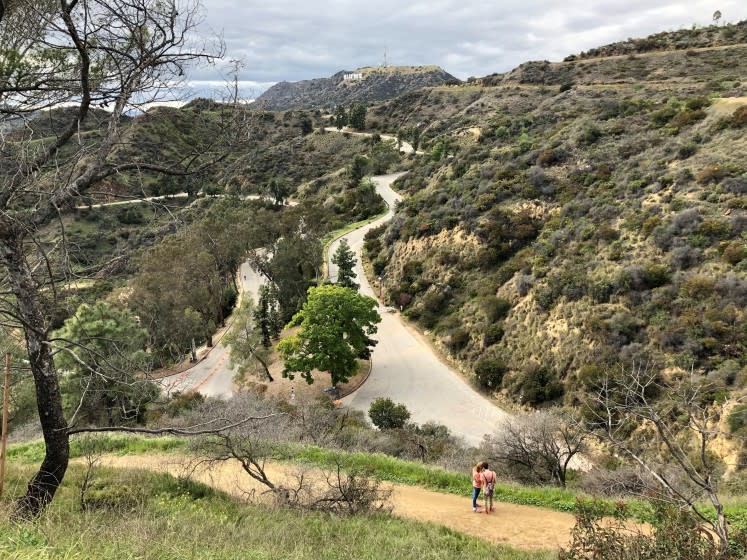 Griffith Park remained open Monday afternoon, but city officials warned that hikers need to keep their distance.