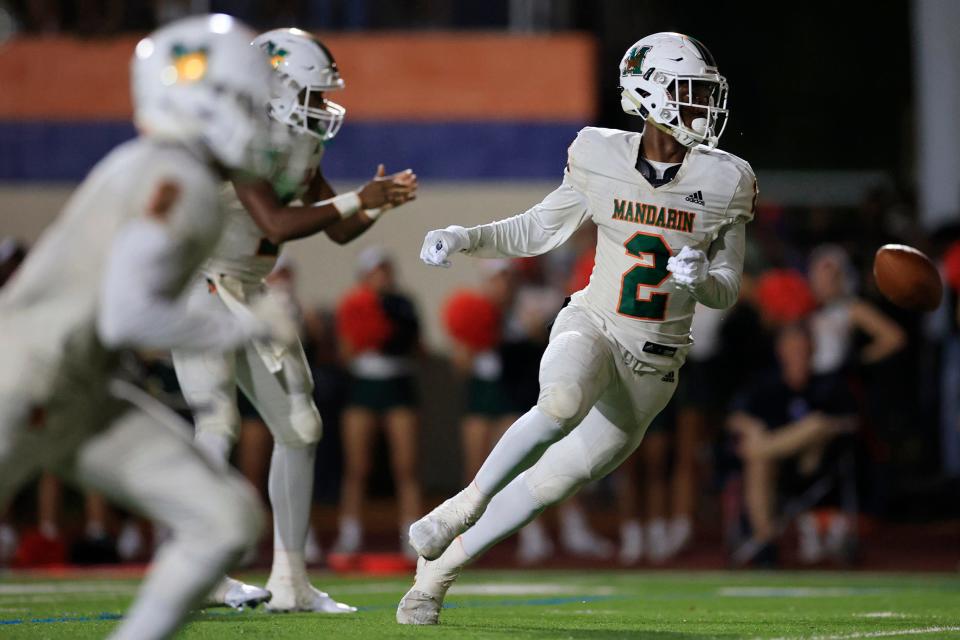 Mandarin wide receiver Jaime Ffrench runs with the ball against Bolles in a 2022 game. The Mustangs and Bulldogs face off in a May 23 spring game.