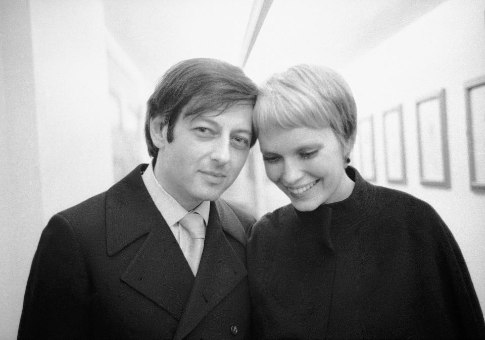Andre Previn and actress Mia Farrow leave Carnegie Hall in New York after Previn conducted the London Symphony Orchestra on on April 30, 1969. The pianist, composer and conductor whose broad reach took in the worlds of Hollywood, jazz and classical music, died on Feb. 28. He was 89. (AP Photo/ETA)