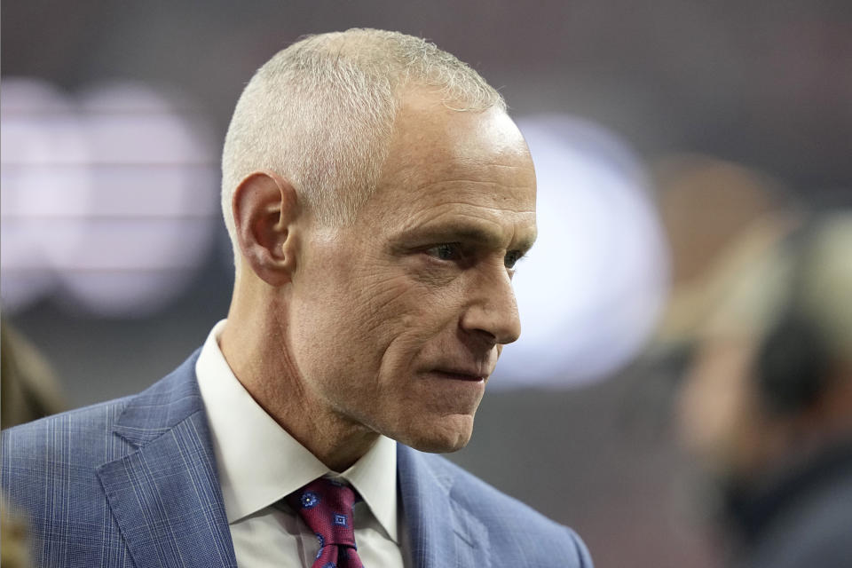 Big 12 Commissioner Brett Yormark walks on the field in the first half of the Big 12 Conference championship NCAA college football game between Oklahoma State and Texas in Arlington, Texas, Saturday, Dec. 2, 2023. (AP Photo/Tony Gutierrez)