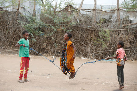 Children jump rope as they play at the Kakuma refugee camp in northern Kenya, March 5, 2018. REUTERS/Baz Ratner