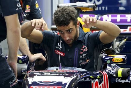 Red Bull Formula One driver Daniel Ricciardo gets out of his car ahead of the Russian Grand Prix in Sochi, Russia October 8, 2015. REUTERS/Maxim Shemetov