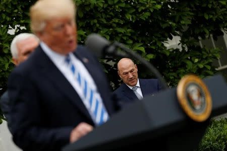 White House National Economic Council Director Gary Cohn listens as U.S. President Donald Trump delivers remarks to members of the Independent Community Bankers Association in the Kennedy Garden at the White House in Washington, U.S., May 1, 2017. REUTERS/Jonathan Ernst/Files