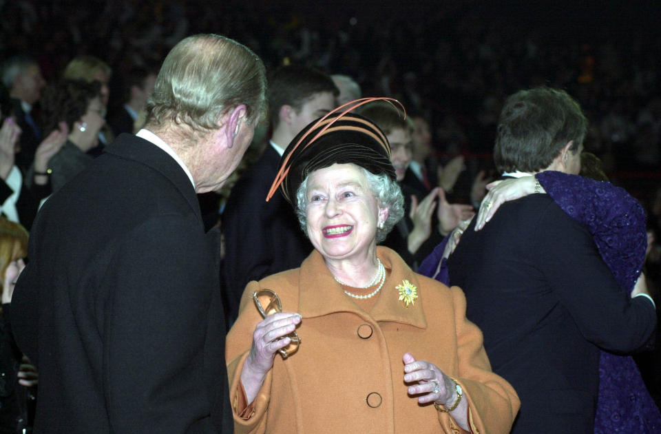 <p>The Queen pictured beaming at her husband as she celebrates with him at the Millennium Dome as the new millennium is ushered in.</p> 