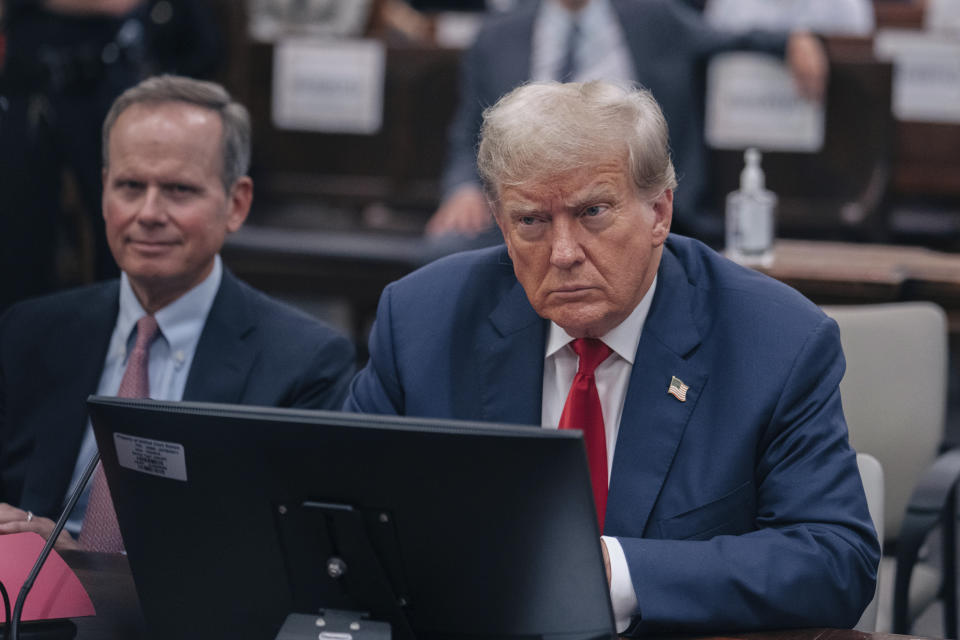 Former President Donald Trump listens during his civil fraud trial at the State Supreme Court building in New York, Wednesday, Oct. 4, 2023. (Jeenah Moon/The New York Times via AP, Pool)