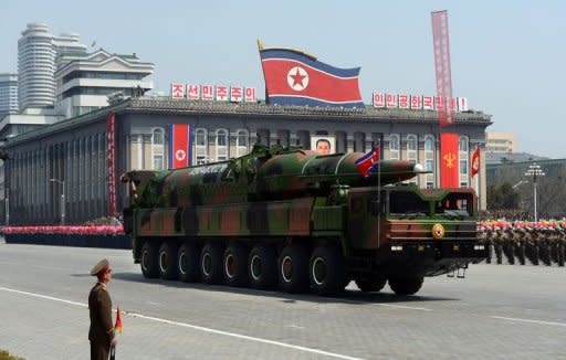 A military vehicle carries what is believed to be a Taepodong-class missile Intermediary Range Ballistic Missile (IRBM) during a military parade in Pyongyang on April 15, 2012. North Korea has warned of retaliation after the US scrapped food aid over its rocket launch, raising fears of a new nuclear test, as China reportedly suspended a refugee deal with its wayward ally