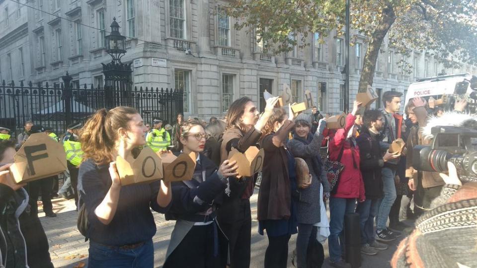 Protesters held up empty takeaway boxes reading