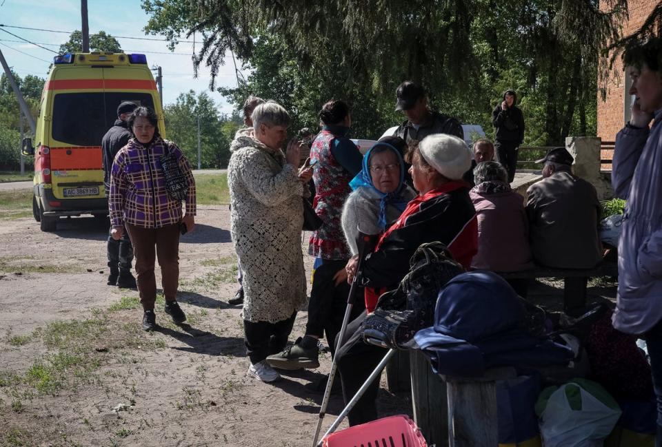 Residents from Vovchansk and nearby villages wait for buses amid an evacuation to Kharkiv (REUTERS)