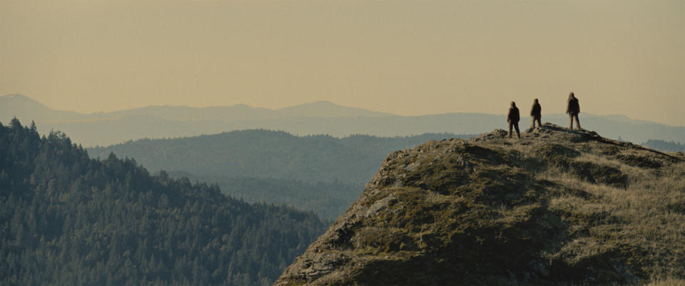 This image released by Bleeker Street shows Jesse Eisenberg, Riley Keough, and Nathan Zellner in a scene from the film "Sasquatch Sunset." (Bleeker Street via AP)