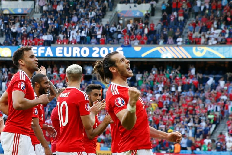 Wales' Gareth Bale (C) acknowledges the fans after their victory in the Euro 2016 round of sixteen match against Northern Ireland, at the Parc des Princes stadium in Paris, on June 25, 2016