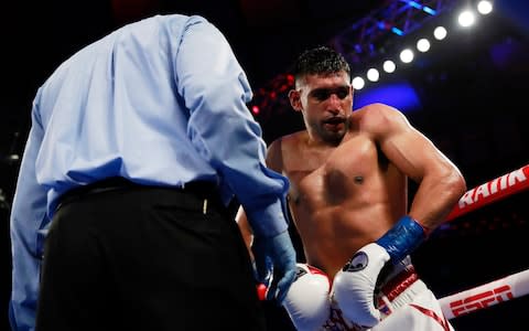 Amir Khan after a low-blow shot from Terence Crawford - Credit: action images