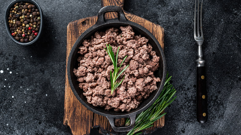 Browned ground meat in pan